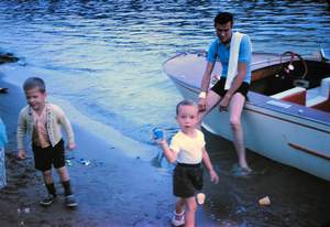 Bob Gilespe and boat with Rick and Gilespe boy Picture 142