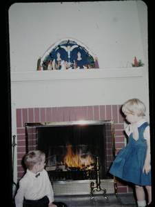 Christmas at Grandmas Bill and Ann looking at fireplace Picture 188